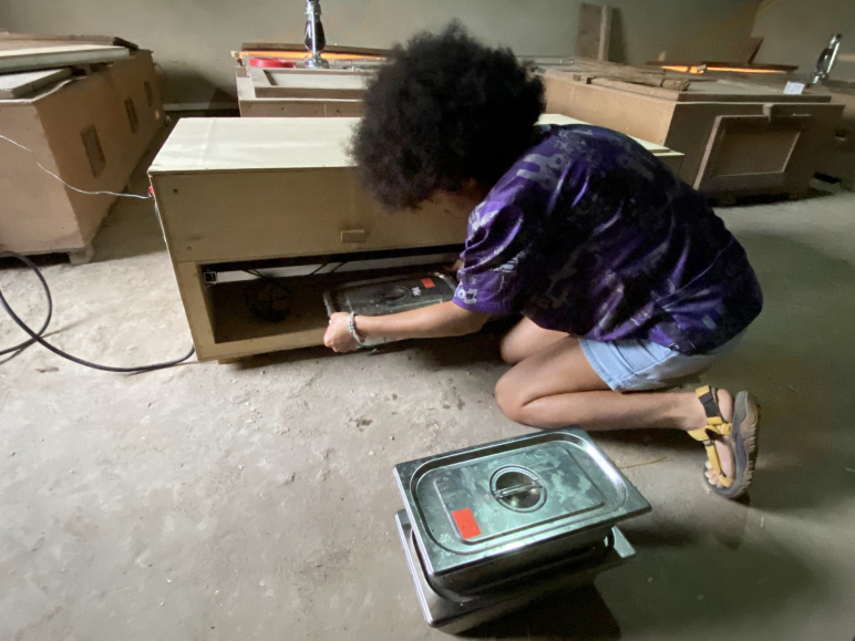 Ambre Delicap loading charged thermal batteries into the prototype