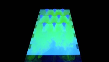 Screenshot of video showing neon green water distributing across islands in model