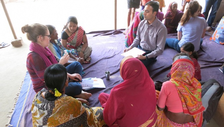 Research team speaking with local women in India