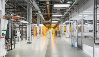 Clean lab set-up with people in hazmat suits