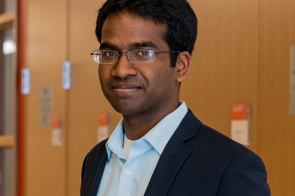 Indian man smiling looking at camera