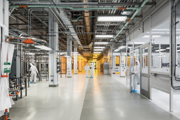 Clean lab set-up with people in hazmat suits