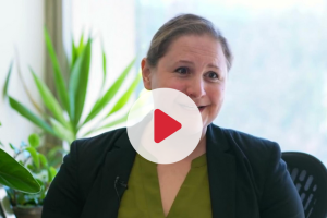 Screenshot of Ariel Furst with the red play button on top to indicate it’s a video