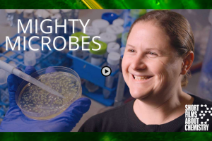A screenshot of Ariel Furst alongside a petri dish and pipette with a play button on top to indicate it’s a video