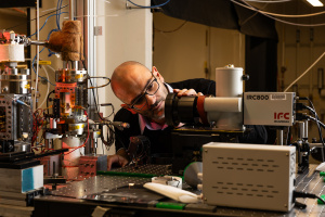 Associate Professor Matteo Bucci examining experimental equipment