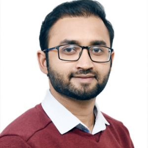 Ickkshaanshu Sonkar, smiling with glasses and red sweater