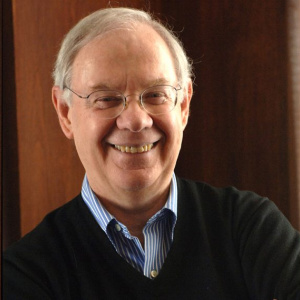 Robert Guy Griffin smiling with eye glasses on