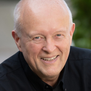 Headshot of Peter Dedon in a black shirt