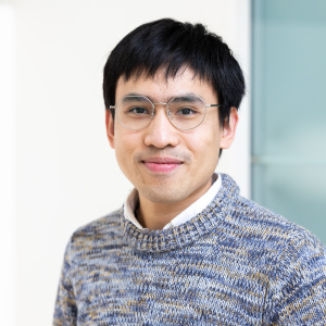 Chotiwat Jantarakasem in a gray sweater and glasses