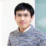 Chotiwat Jantarakasem in a gray sweater and glasses