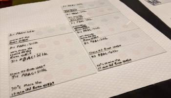 Microscope slides with silk samples on paper towel