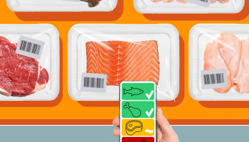A hand holding an app with four multicolored boxes on it over packages meat and fish. 