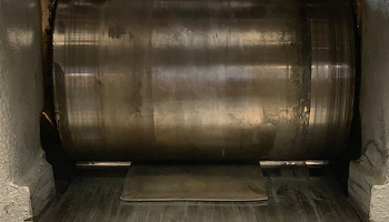 A piece of metal going out of a roller 