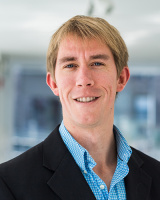 Brendan Smith in a blue shirt and black blazer