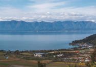 A reservoir surrounded by mountains and farmland